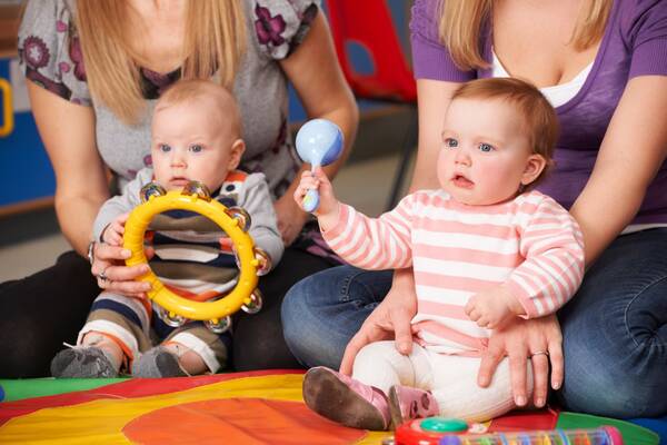 Two babies with musical instruments